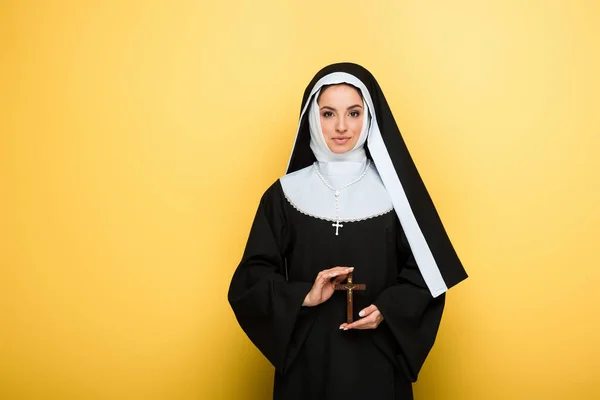 Beautiful Happy Nun Holding Cross Yellow — Stock Photo, Image
