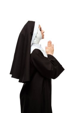 beautiful nun praying with closed eyes and hands together isolated on white clipart