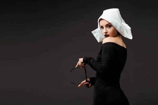 Sexy Young Nun Black Dress Holding Sunglasses Isolated Grey — Stock Photo, Image
