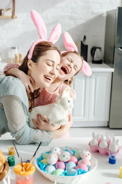 Happy Mother Hugging Cute Daughter Bunny Ears Toy Rabbit — Stock Photo, Image