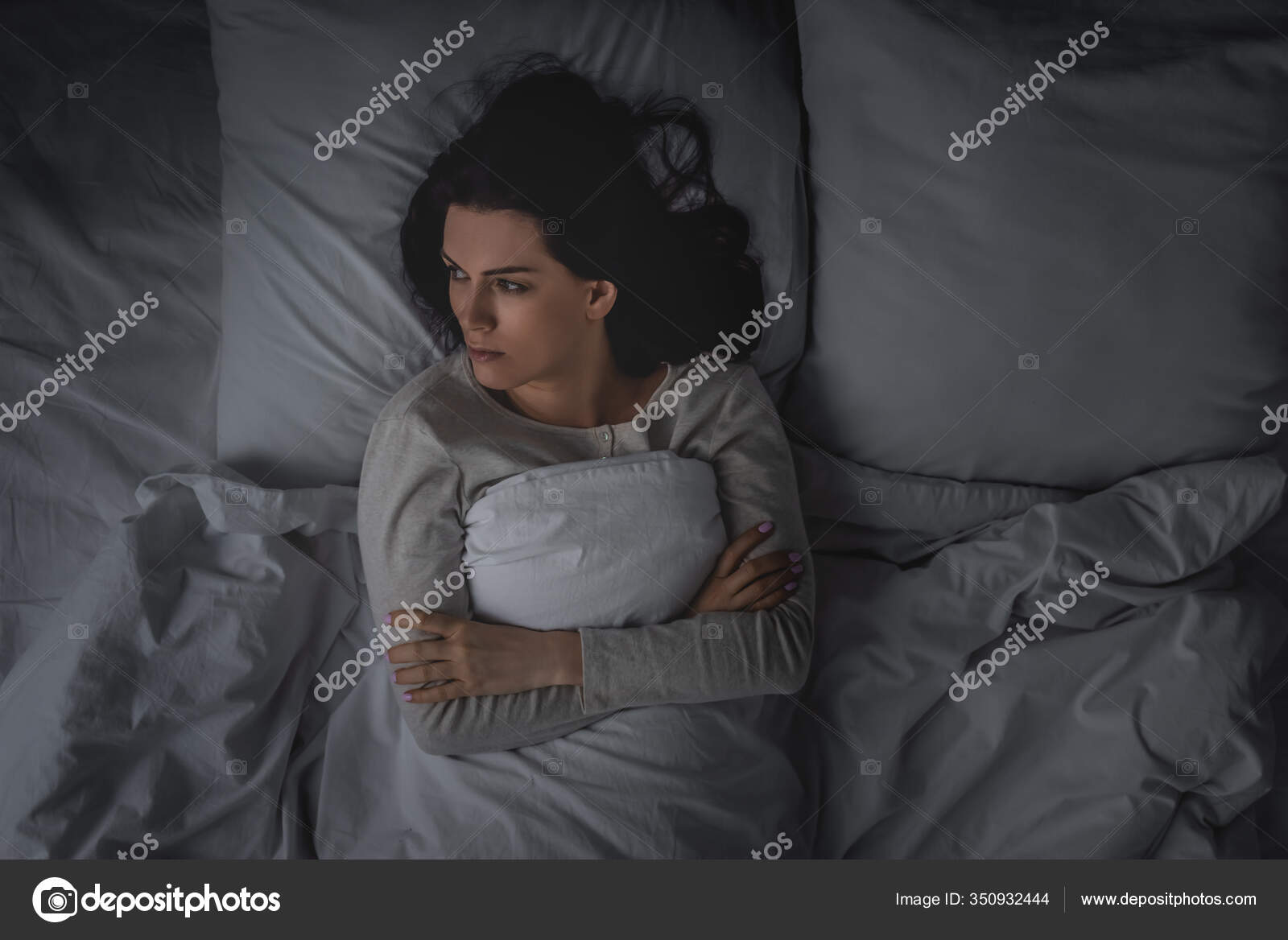Top View Woman Sleep Disorder Crossed Arms Lying Bedroom Stock Photo by