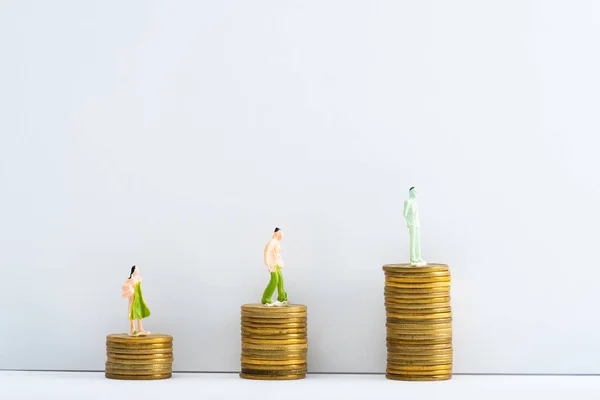 Row People Figures Coins White Surface Grey Background Concept Financial — Stock Photo, Image