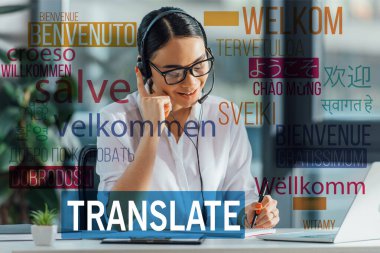 smiling asian translator working online with headset and laptop in office, welcome translation illustration clipart