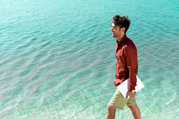 Side View Smiling Handsome Freelancer Laptop Walking Turquoise Water — Stock Photo, Image