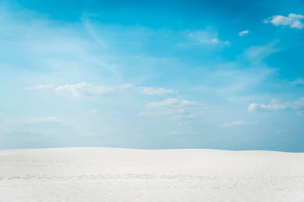 beautiful clean beach with white sand and blue sky with white clouds