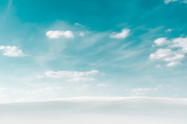 beautiful beach with white sand and blue sky with white clouds