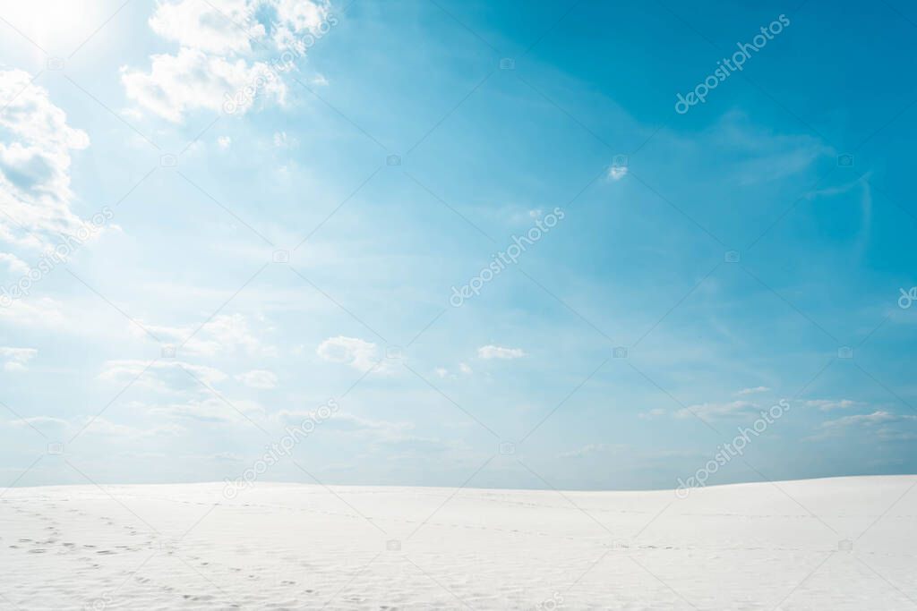 beautiful clean beach with white sand and blue sky with white clouds