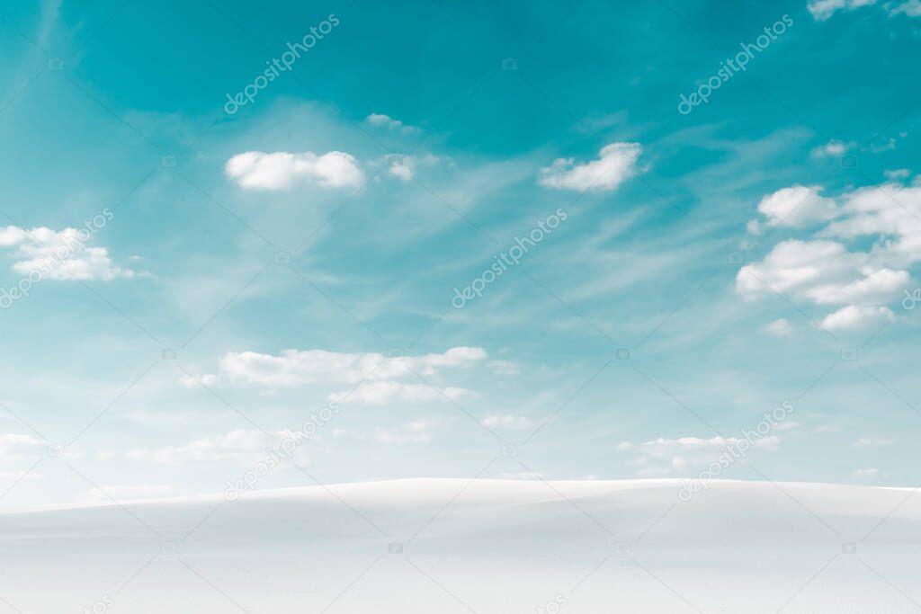 beautiful beach with white sand and blue sky with white clouds