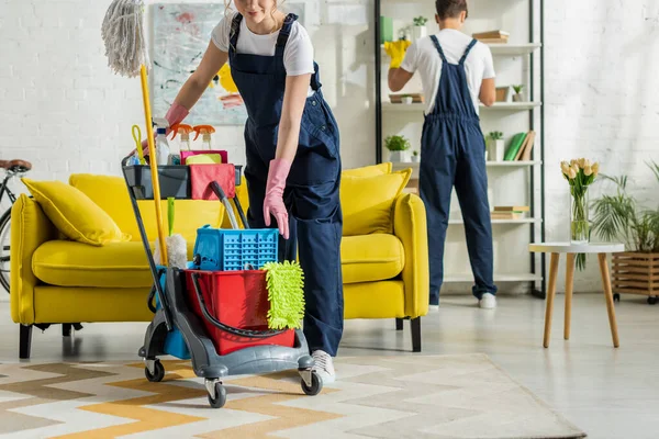 Cropped View Happy Girl Overalls Standing Cleaning Trolley — Stock Photo, Image
