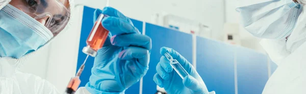 Panoramic Shot Biochemist Taking Medicine Syringe Colleague Holding Ampule — Stock Photo, Image