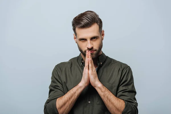 Handsome Man Praying Hands Looking Camera Isolated Grey — Stock Photo, Image