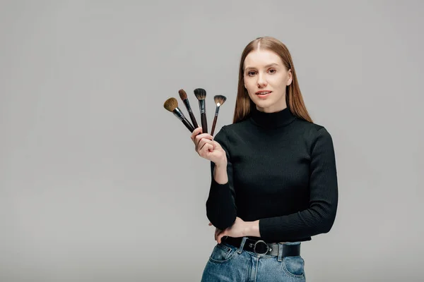 Attractive Makeup Artist Holding Makeup Brush Set Isolated Grey — Stock Photo, Image