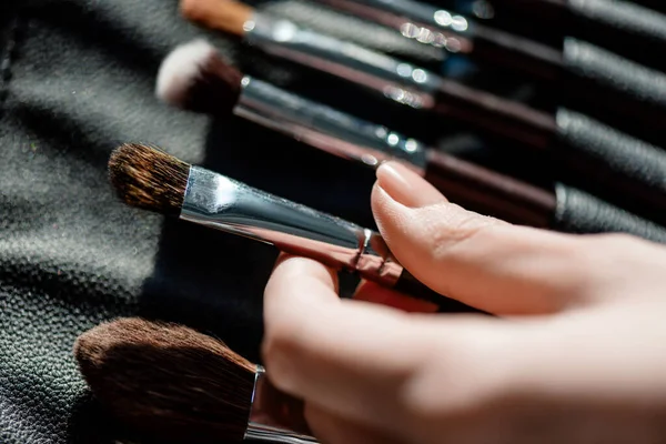 Cropped view of makeup artist taking cosmetic brush — Stock Image Cropped View Makeup Artist Taking Cosmetic Brush Stock Image