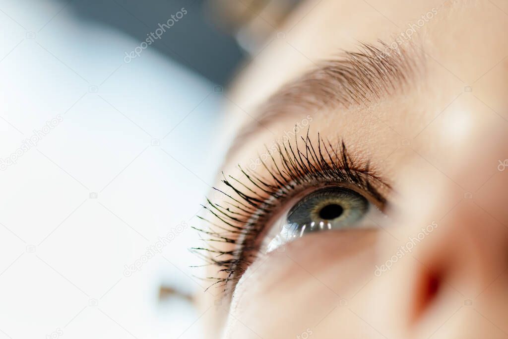 low angle view of woman with mascara on eyelashes 