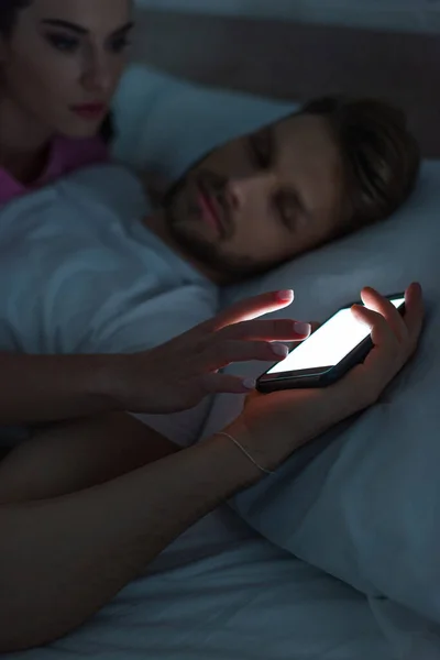 Selective Focus Woman Taking Smartphone Sleeping Boyfriend Bed Night — Stock Photo, Image