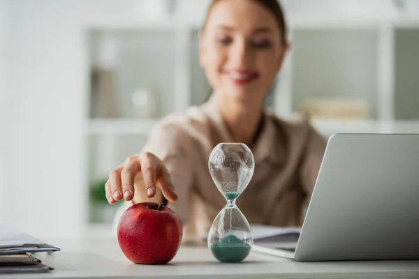 Selective Focus Positive Beautiful Businesswoman Sitting Workplace Apple Sand Clock — Stock Photo, Image