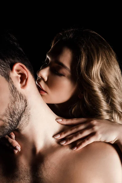 Sexy Young Woman Embracing Man Kissing His Neck Isolated Black — Stock Photo, Image