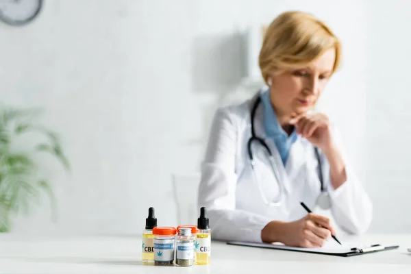 Selective Focus Bottles Medical Cannabis Cbd Mature Doctor Writing Prescription — Stock Photo, Image