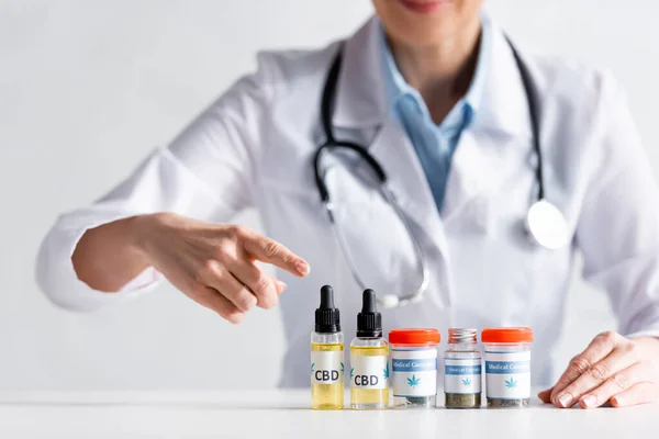 Cropped View Doctor Pointing Finger Bottles Cbd Lettering — Stock Photo, Image