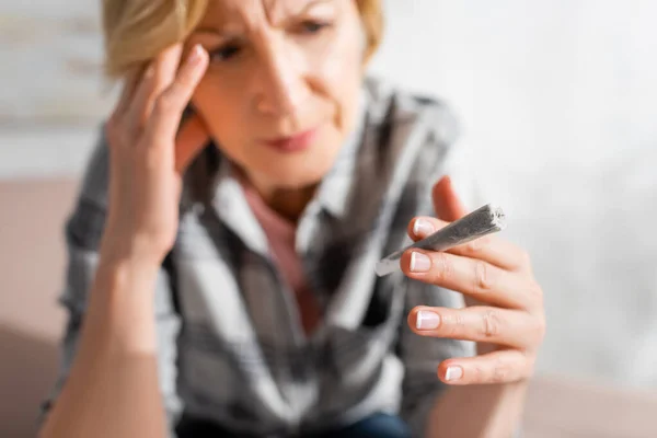 Selective Focus Mature Woman Headache Looking Joint Legal Marijuana Home — Stock Photo, Image