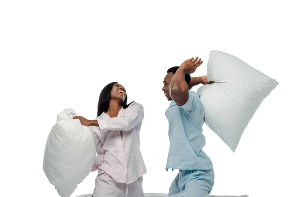 Feliz Africano Americano Pareja Teniendo Almohada Lucha Pijama Aislado Blanco —  Fotos de Stock