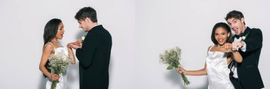 Damat kolajı Afrika kökenli Amerikalı gelinin parmağına nikah yüzüğü takıyor ve ırklar arası yeni evliler beyaz arka planda alyanslarla el ele tutuşuyor.