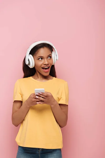 Cheerful African American Girl Wireless Headphones Using Smartphone While Looking — Stock Photo, Image