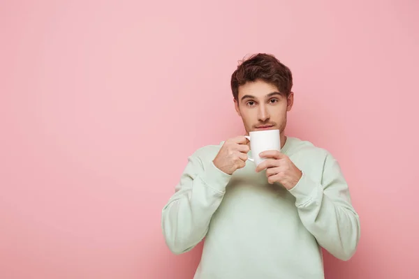 Handsome Young Man Holding White Cup While Looking Camera Pink — Stock Photo, Image