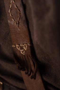 close up view of medieval Scottish brown leather clothing clipart