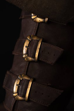 close up view of medieval Scottish brown leather shoes with buckles clipart