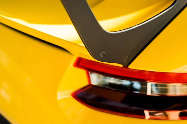 KYIV, UKRAINE - OCTOBER 7, 2019: selective focus of yellow porshe with red headlight — Stock Photo