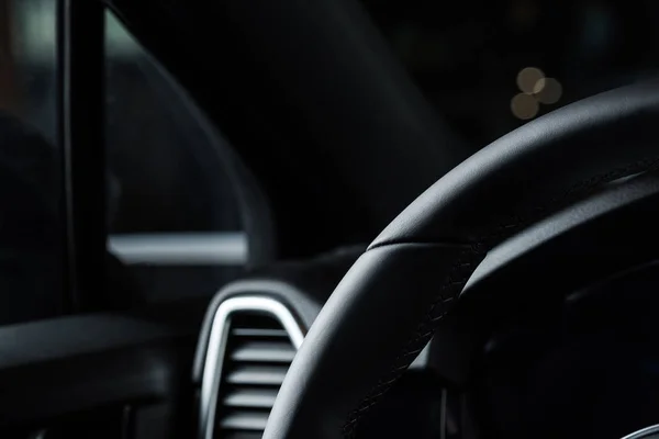 KYIV, UKRAINE - OCTOBER 7, 2019: close up of black leather steering wheel in luxury porshe — Stock Photo