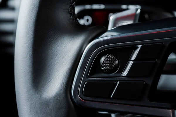 KYIV, UKRAINE - OCTOBER 7, 2019: close up of black steering wheel with horn button in porshe — Stock Photo