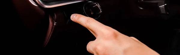 KYIV, UKRAINE - OCTOBER 7, 2019: panoramic shot of driver pressing button in modern porshe — Stock Photo