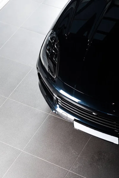 KYIV, UKRAINE - OCTOBER 7, 2019: black and shiny porshe in car showroom — Stock Photo