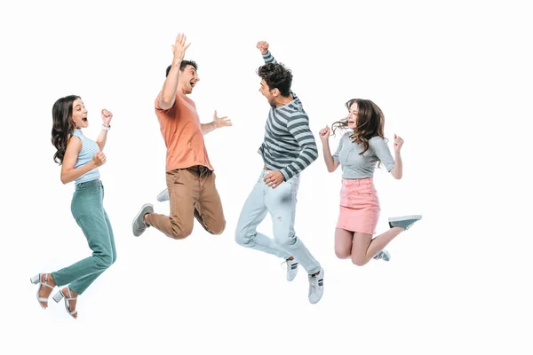 Excited friends jumping together, isolated on white — Stock Photo