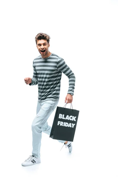 Homme excité courir avec sac à provisions le vendredi noir, isolé sur blanc — Photo de stock