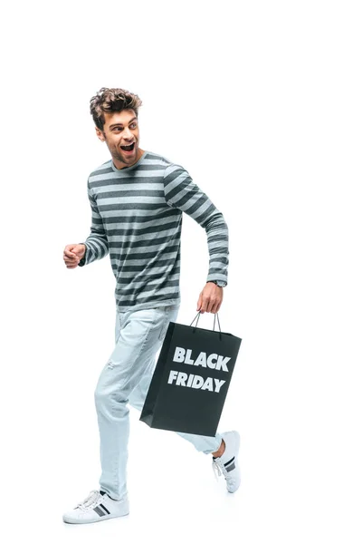 Allegro uomo in esecuzione con shopping bag il venerdì nero, isolato su bianco — Foto stock