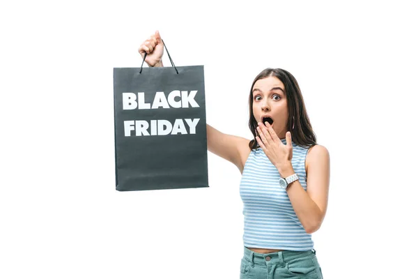 Shocked woman holding shopping bag on black friday, isolated on white — Stock Photo