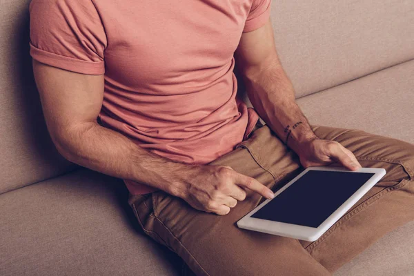 Cropped view of man using digital tablet with blank screen — Stock Photo