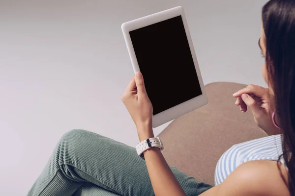 Cropped view of woman using digital tablet with blank screen, isolated on grey — Stock Photo