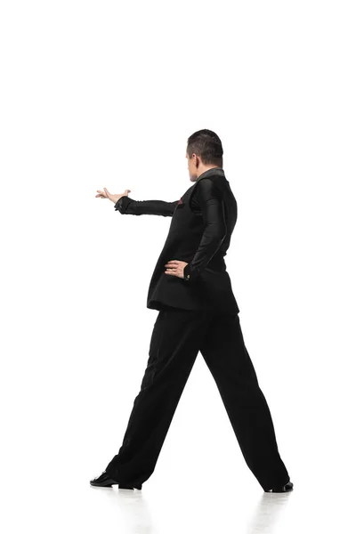 Back view of stylish tango dancer inviting to dance on white background — Stock Photo