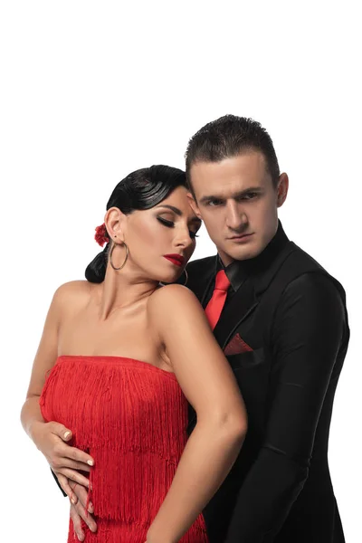 Bello, sicuro ballerino abbracciare partner durante l'esecuzione di tango isolato su bianco — Foto stock