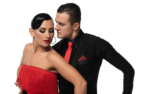 Bailarines sensuales y elegantes realizando tango aislado sobre blanco - foto de stock