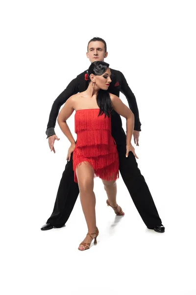 Leidenschaftliches, elegantes Tanzpaar, das Tango auf weißem Hintergrund aufführt — Stockfoto