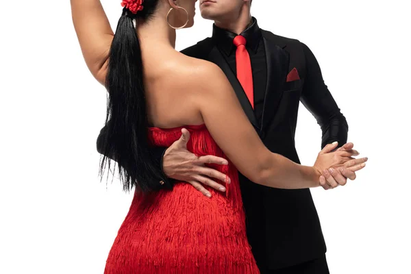 Vista recortada de bailarines elegantes realizando tango aislado en blanco - foto de stock