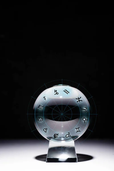 Crystal ball with zodiac signs isolated on black — Stock Photo