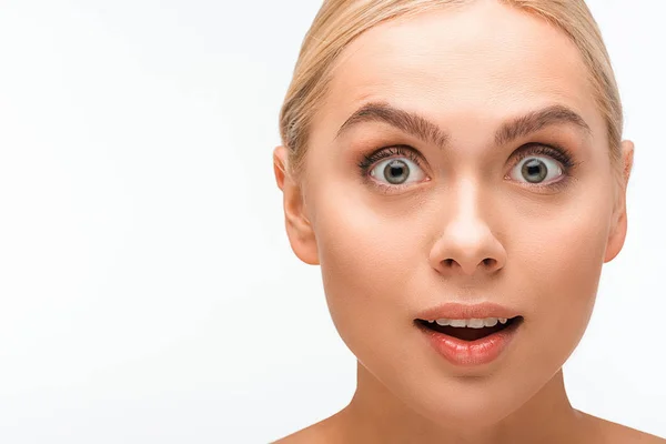 Surprised woman looking at camera isolated on white — Stock Photo