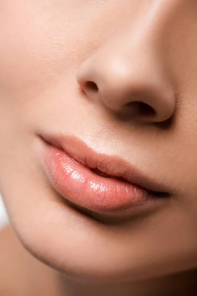 Cropped view of girl with shiny lip gloss on lips — Stock Photo