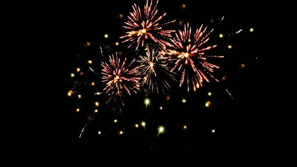 Fuegos artificiales tradicionales de color naranja en el cielo oscuro de la noche, aislados en negro - foto de stock